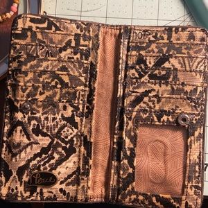 Sakroots peace wallet with lots of credit card slots. Good condition